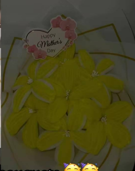 Yellow fuzzy wire flower bouquet with Happy Mother's Day topper