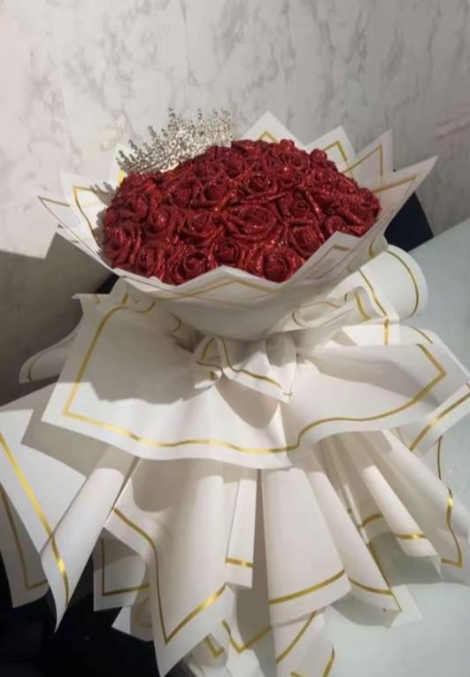 Red glitter bouquet with a jewelled crown topper